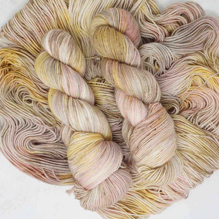 Sandy Sundae hand dyed yarn in soft sand, cream and blush pink tones | Market Town Yarns