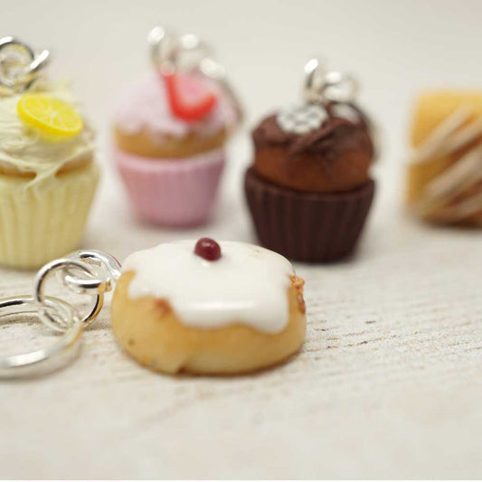 Donut-shaped keychain with other donut-themed items on a light surface | Market Town Yarns