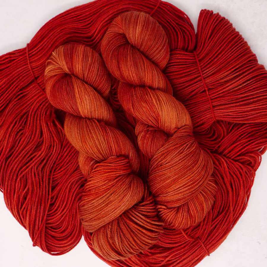 Vixen, fox red hand dyed yarn colourway shown on Squishy Sock base | Market Town Yarns