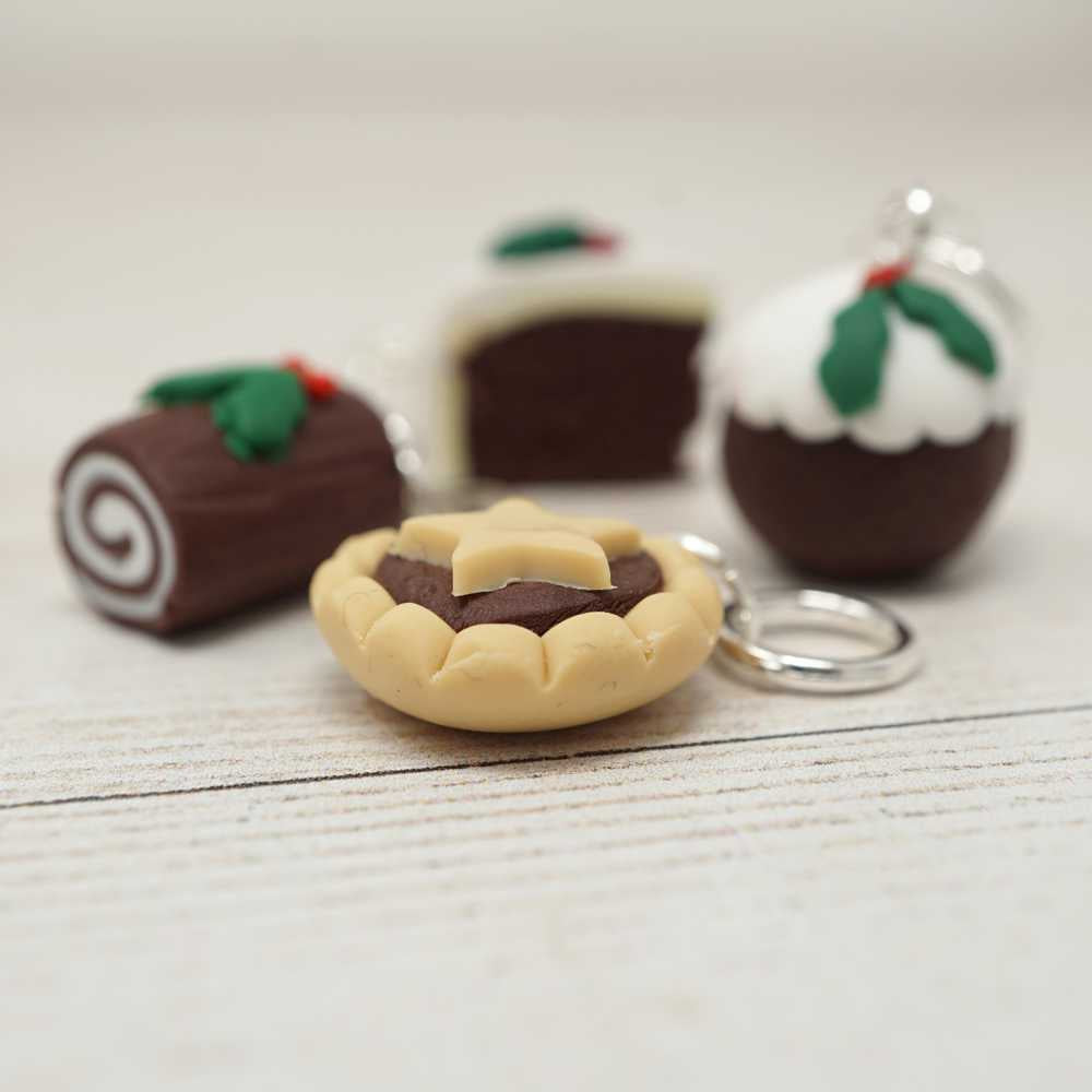 Handmade Polymer Clay Stitch Marker / Progress Keeper - Christmas Cake shown with fixed ring fitting | Market Town Yarns