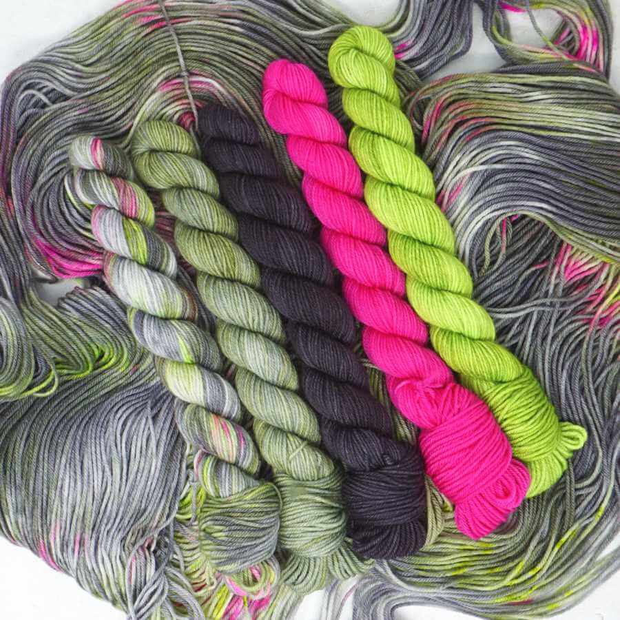 Don't Feed the Trolls Theme Pack with five coordinating hand dyed 20g mini skeins on the Squishy Sock yarn base.