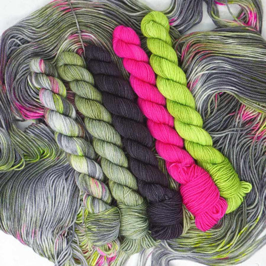 Don't Feed the Trolls Theme Pack with five coordinating hand dyed 20g mini skeins on the Squishy Sock yarn base.