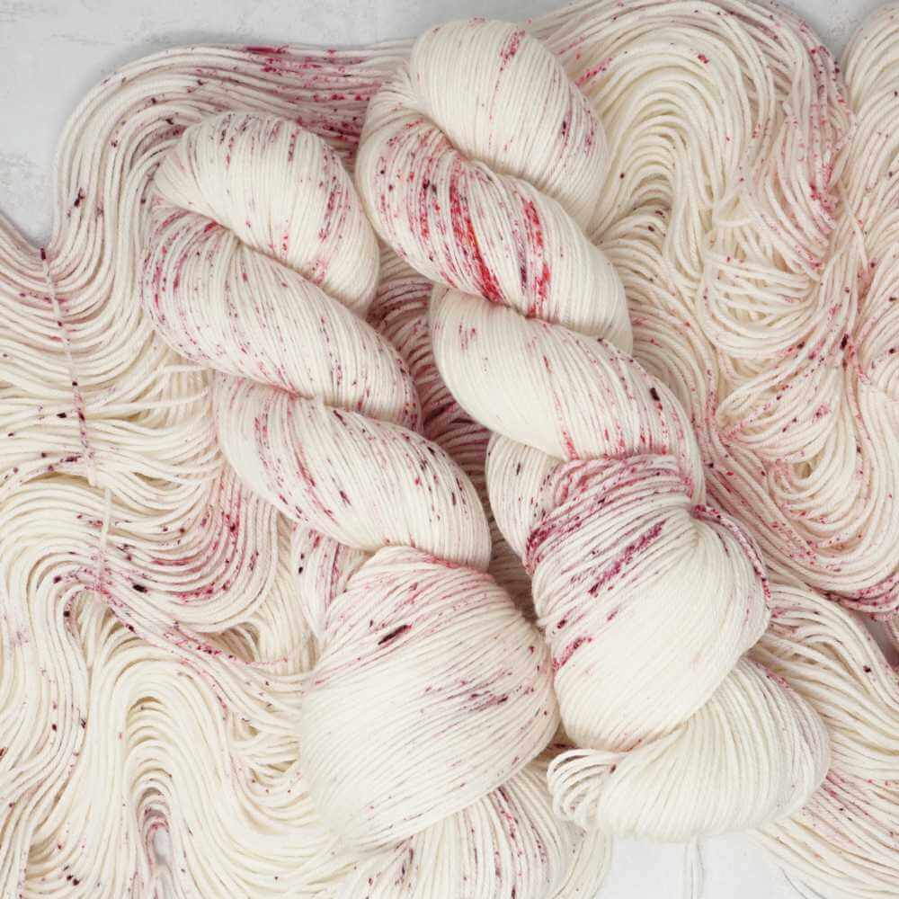 Market Town Yarns Cherry Blossom Kiss hand-dyed yarn with pink speckles on a soft cream base | Market Town Yarns

