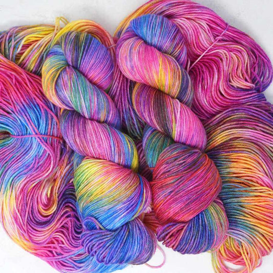 Woodstock hand dyed rainbow sock yarn on Market Town Yarns Squishy Sock merino nylon 4-ply base in pink, blue, yellow and violet | Market Town Yarns