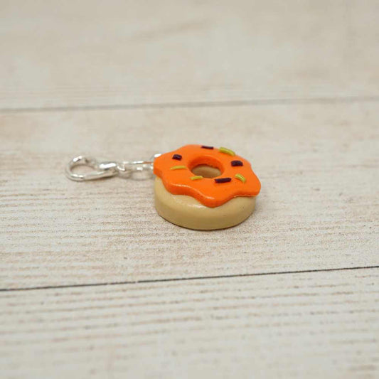 Handmade Polymer Clay Stitch Marker / Progress Keeper - Orange Ghoulish Doughnut | Market Town Yarns