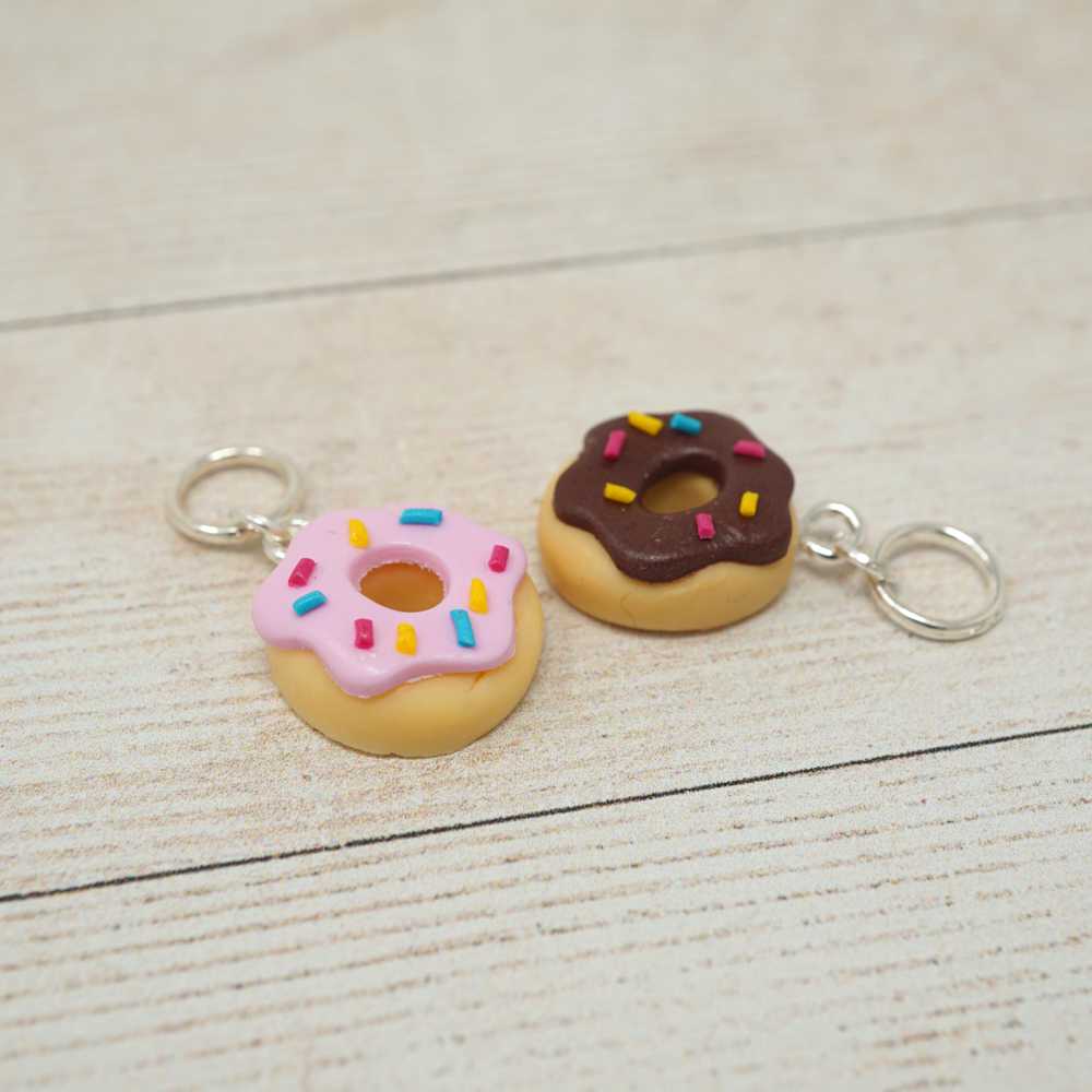 Two donut-shaped keychains with sprinkles on a light wooden surface | Market Town Yarns