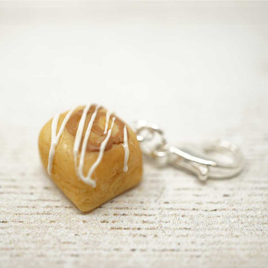 Heart-shaped keychain with white drizzle on a light wooden surface | Market Town Yarns