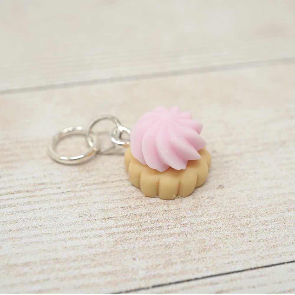Keychain with a pink cream puff on a light wooden surface | Market Town Yarns